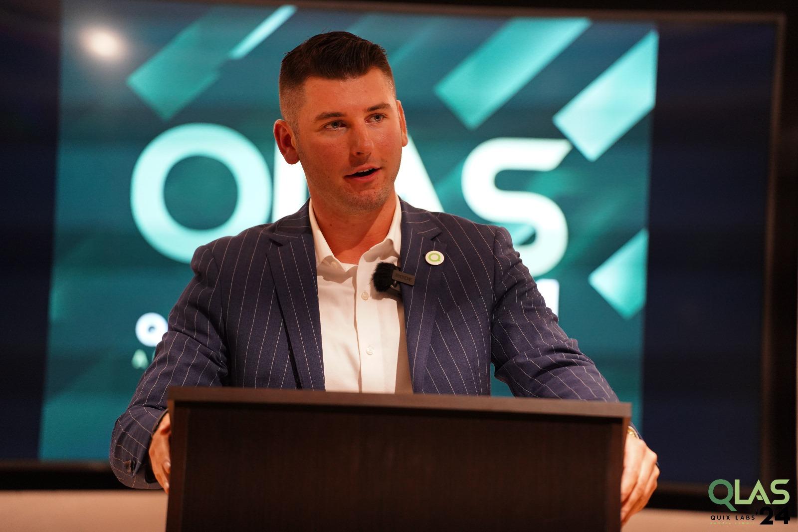Zach Starr speaking at the QLAS annual summit